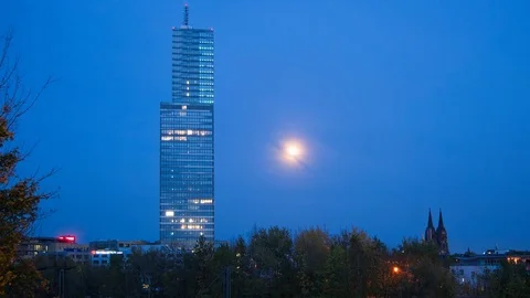 Timelapse of moon rising behind skyscraper at night at Mediapark, Cologne Stock Footage 81764462