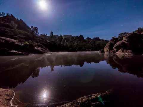 Timelapse of Moon Setting and Sunrise over Reservoir 4.6K Stock Footage 81572591