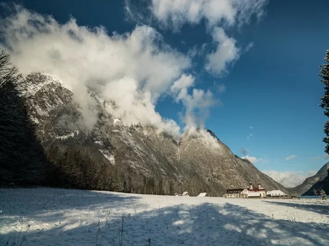 Timelapse - morning clouds on sunlit alps in konigssee Stock Footage 72235567