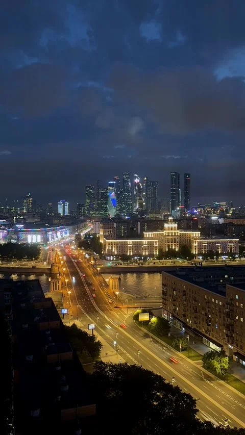Timelapse of Moscow skyline at sunset, with towering skyscrapers above historic Stock Footage 310993534