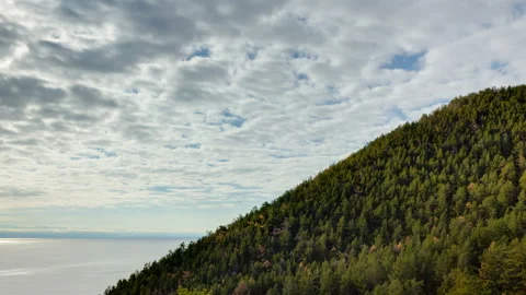 Timelapse of motion clouds, mountain, sea and forest Stock Footage 103029436