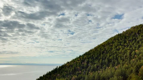 Timelapse of motion clouds, mountain, sea and forest Stock Footage 103029585
