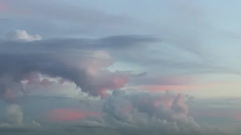 Timelapse motion video of beautiful blue pink clouds in the rays of setting sun. Stock Footage 281600136