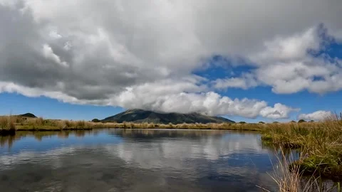 Timelapse of Mount Taranaki's Reflection in Pouakai Tarns  A Scenic Alpine .. Stock Footage 285372238