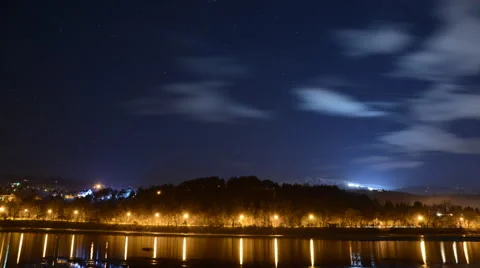 Timelapse of mountain and sky reflected in lake Stock Footage 45363444