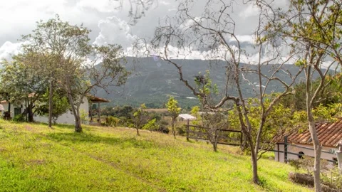 TimeLapse of mountain and tree with house 4K 30fps Stock Footage 263512351