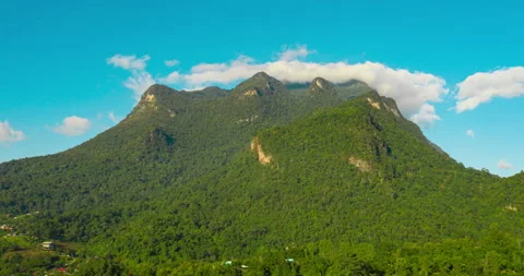 Timelapse of mountain with floating cloud on the top of hill Stock Footage 203179450