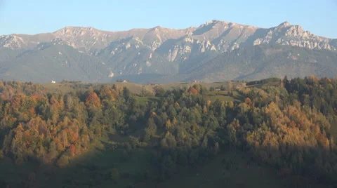 Timelapse of mountain landscape covered shadow night fall sunlight motion forest Video stock 43074746