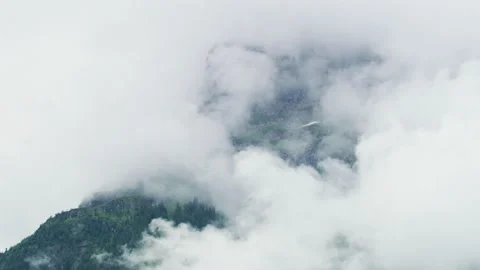 Timelapse of a mountain peak shrouded in clouds Stock Footage 219715673