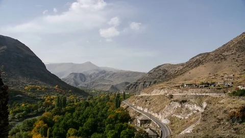 Timelapse of mountain road traffic. View to the serpentine with cars. Nature Stock Footage 82181680