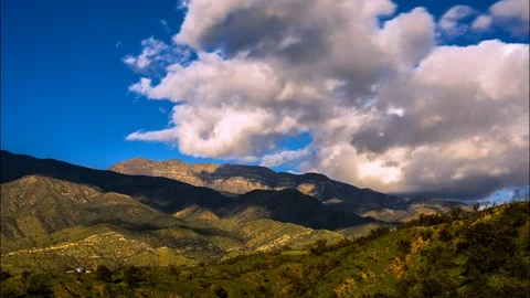 Timelapse of Mountainous landscape of Ojai with greenfields and sunset clouds Stock Footage 115729608