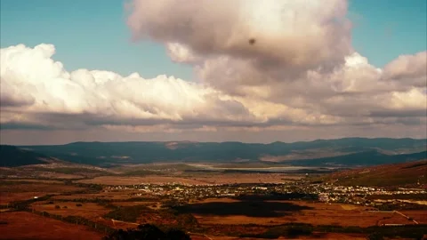 Timelapse. Mountains, fields and clouds. A view from a height on a wide field on Stock Footage 140001262