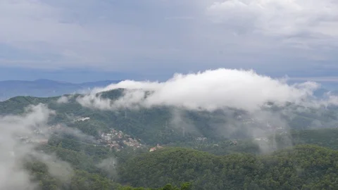 Timelapse Mountains Landscape With low flying approaching Clouds Stock Footage 99921889