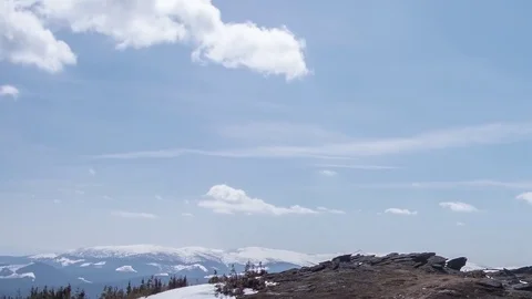 Timelapse mountains with snow-covered pine forests over which runs lit Stock Footage 69831685