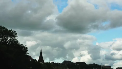 Timelapse of movement of beautiful clouds over an old European city Vídeos de archivo 255480412