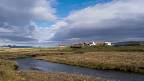Timelapse of the movement of clouds and sun over a small village in Iceland. Stock Footage 170299272