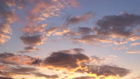 Timelapse of movement of clouds at sunset. Golden sky at magic hour. 4K Stock Footage 318633230