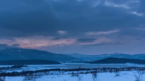 Timelapse of the movement of clouds in winter after sunset. Stock Footage 147038086