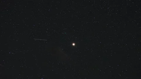 Timelapse of the movement of Mars in the night sky among the clouds Stock Footage 146391331