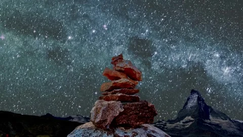 Timelapse movement in the night sky. Stone tower and horizon view. Stock Footage 306314124
