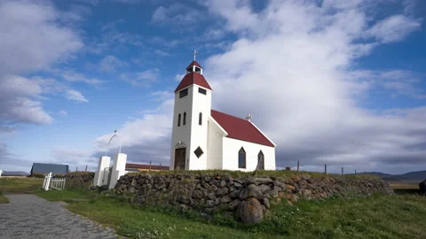 Timelapse of the movement of the sun and clouds over an Icelandic church Stock Footage 170299276