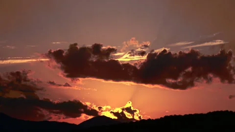 Timelapse of the movement of the sun and clouds at sunset. Autumn red sky. 4K Stock Footage 285912735