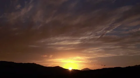 Timelapse of the movement of the sun and clouds at sunset. Autumn red sky. 4K Stock Footage 287691557