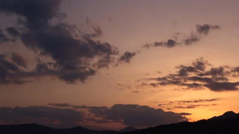Timelapse of the movement of the sun and clouds at sunset. Autumn red sky. 4K Video stock 314591260