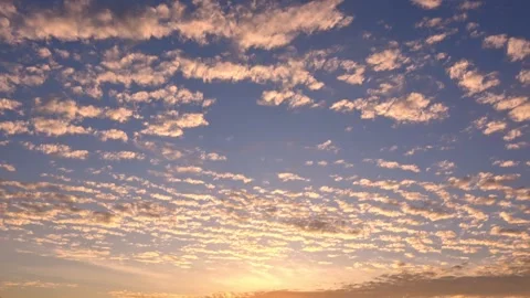 Timelapse of the movement of the sun and clouds at sunset. Autumn golden sky. 4K Stock Footage 337458904