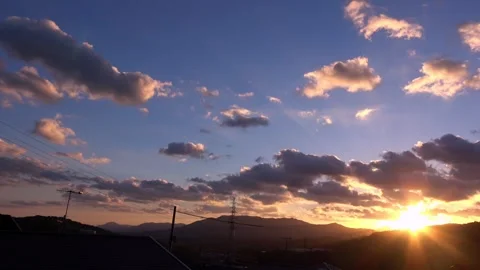 Timelapse of the movement of the sun and clouds at sunset. Autumn red sky. 4K Stock Footage 346127949