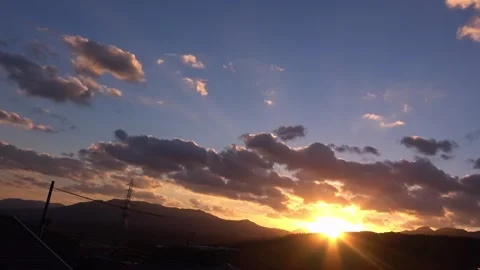 Timelapse of the movement of the sun and clouds at sunset. Autumn red sky. 4K Stock Footage 346127969