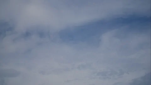 Timelapse moving beautiful white cloud with blue sky background at day time Stock Footage 129929694