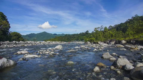 Timelapse of moving cloud and riverat Kota Belud, Sabah. Stock Footage 200859407