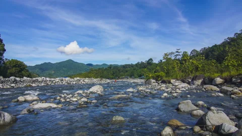 Timelapse of moving cloud and riverat Kota Belud, Sabah. Stock Footage 201275293