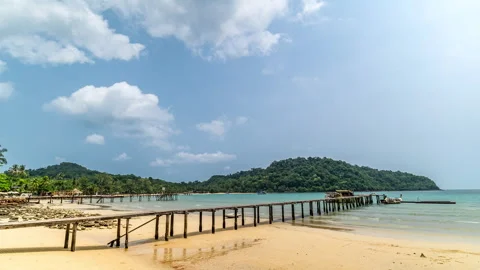 Timelapse of moving clouds above beautiful white sand beach at Koh Kood Stock Footage 272612338