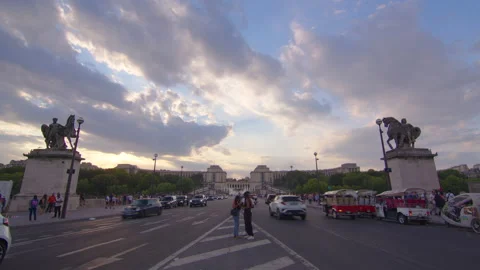 Timelapse, moving clouds in the background. People are walking in Paris. Stock Footage 219932431