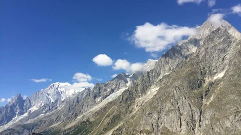 Timelapse of moving clouds in blue sky in mountain scenery Stock Footage 71047232