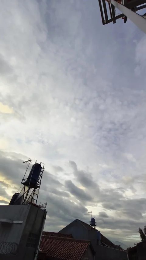 Timelapse of Moving Clouds from Day to Sunset with Blue Sky (No Audio) Stock Footage 310891603