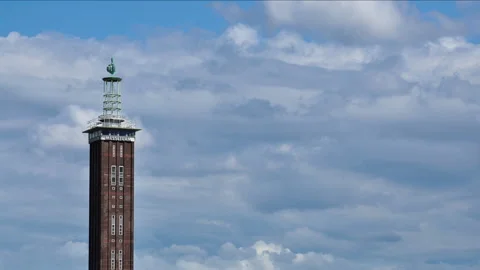 Timelapse of moving clouds with old messe tower on sunny day cologne germany Stock Footage 250082047