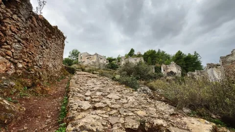 Timelapse of Moving Clouds over Abandoned Kayaköy Ghost Village Ruins, Fethiye,  Video stock 294092582