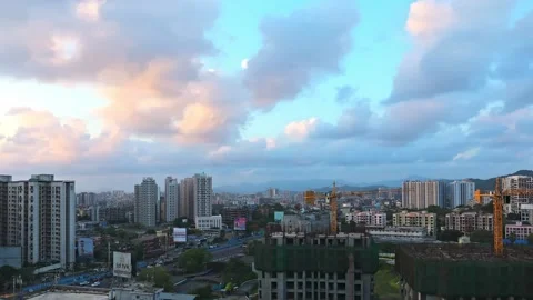 Timelapse of Moving Clouds over a city evening day to night Stock Footage 157379461
