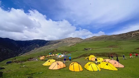 Timelapse of moving clouds over himalayan meadow 스톡 동영상 76994811