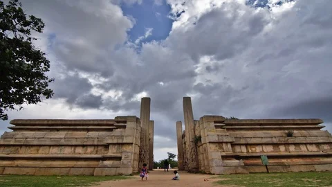 Timelapse of moving clouds over an incomplete temple structure 스톡 동영상 87319795