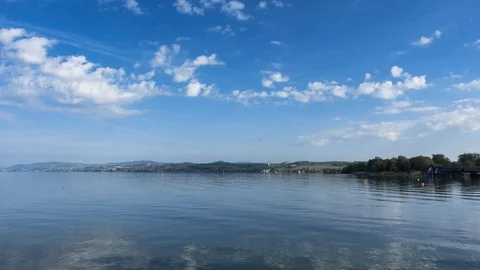 Timelapse - Moving clouds over Lake Constance Видео 108202292