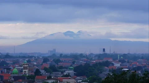 Timelapse moving clouds over Salak Mountain with resident housing 4K Jakarta Video stock 237235335