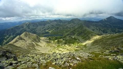 Timelapse moving clouds over sunny mountain peak Video stock 93691775