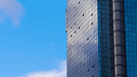 Timelapse: moving clouds reflecting on glass skyscraper in Istanbul 動画素材 341279710