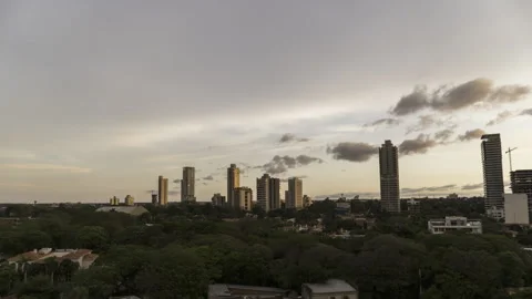 Timelapse of moving clouds with skyscrapers at sundown in asuncion paraguay Stock Footage 249551149