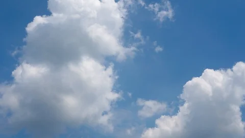Timelapse of Moving Clouds with stunning blue skies 動画素材 119968038