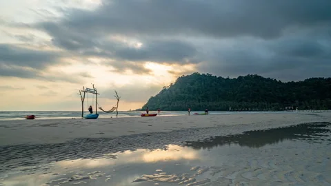 Timelapse of moving clouds at sunset above white sand beach at Koh Kood Stock Footage 272613792